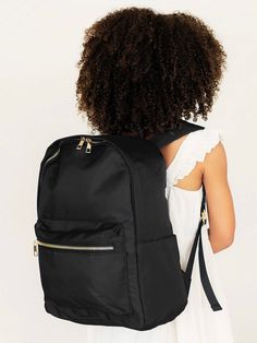 Whether this Backpack is for school or travel, it is the perfect combination of fun and functional! The adjustable shoulder straps make this backpack super easy to carry and it is a breeze to find just the right place for everything in the large interior compartment and exterior pocket. Pro Tip: Add embroidery or a fun patch for a personal touch! Water Resistant Twill Nylon Interior Lining Interior Zipper Pocket Exterior Front Zipper Pocket 2 Exterior Open Side Pockets Top Handle Adjustable, Comfort Fit Shoulder Straps Gold Toned Metal Hardware Duel Zipper Closure Coordinating Lunch Box & Accessory Bags Available Pajama Romper, Pro Tip, Cool Patches, Pocket Top, Valentines Day Party, Summer Accessories, Black Backpack, Metal Hardware, Girls Shopping