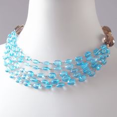 Luxury Blue Necklace With Polished Beads, Blue Multi-strand Gemstone Necklaces, Blue Gemstone Multi-strand Necklaces, Light Blue Multi-strand Jewelry As Gift, Light Blue Multi-strand Jewelry For Gift, Light Blue Multi-strand Jewelry Gift, Formal Blue Glass Jewelry, Blue Multi-strand Gemstone Beaded Necklace, Luxury Blue Jewelry With Polished Beads