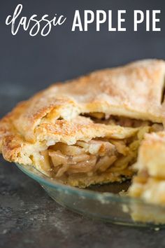 an apple pie is cut in half and sitting on a table with the words classic apple pie