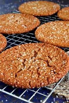 several cookies are cooling on a wire rack