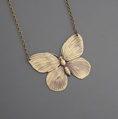 "Vintage Necklace - Butterfly Necklace - Brass Necklace - Butterfly Jewelry - Statement Necklace - handmade jewelry This is such a fabulous vintage brass necklace!  A lovely large butterfly.  Great detail with a beautiful patina.  The pendant hangs from a delicate vintage brass ladder chain. Chloe says, \"Wear it and feel fabulous!\" This pendant is 2\" wide.  Thanks for visiting Chloe's" Vintage Gold Butterfly Jewelry, Butterfly Charm Brass Jewelry Gift, Brass Jewelry With Butterfly Charm For Gift, Bohemian Gold Butterfly Jewelry, Gold Nickel-free Butterfly Necklace, Gold Butterfly-shaped Brass Jewelry, Nickel Free Gold Butterfly Necklace, Vintage Handmade Butterfly Necklace, Vintage Bronze Jewelry For Crafting