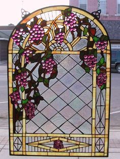 a stained glass window with flowers on it