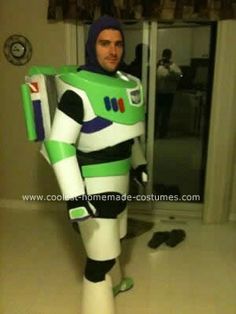 a man dressed as buzz lightyear from the animated movie buzz lightyear, standing in front of a doorway