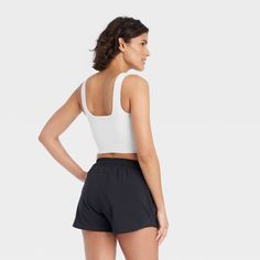 Why we're ALL IN: Seamless tank top with a ribbed solid-color finish, pullover design and cropped cut. Crafted from midweight fabric with spandex and moisture-wicking properties to keep you feeling cool and fresh during any activity. Tailored in a fitted, cropped length and finished with a wide square neckline on the front and back. All in Motion™: Made for every move, priced for every day. All In Motion, Pullover Designs, Womens Clothing Sizes, Pair Of Pants, Square Necklines, Body Measurements, Cropped Tank Top, Crop Tank, Square Neckline