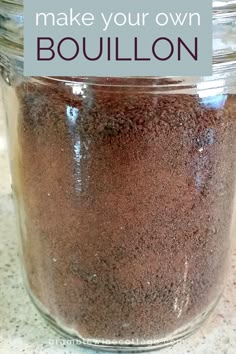 a jar filled with brown stuff sitting on top of a counter next to a blue sign that says make your own bouillon