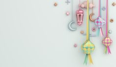 an assortment of toys hanging on the wall with stars and moon decorations around them,