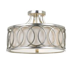 a light fixture with an oval design on the bottom and round metal trim around it