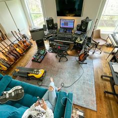 a living room filled with lots of musical equipment