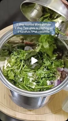 a person pouring some food into a pot