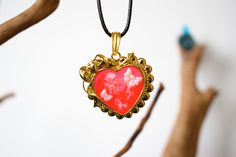 A red heart is mainly used as a symbol of love. Heart pendant, colored resin. Gold metal pendant, colored UV resin. The decoration was done by myself. Sent in gift packaging in a tracked package. https://crealliot.etsy.com Enamel Heart Pendant Necklace As Gift, Heart Pendant Enamel Necklace Gift, Heart Pendant Enamel Necklace For Gift, Enamel Heart Charm Necklace For Gifts, Red Heart-shaped Hand Painted Jewelry, Hand-painted Red Jewelry For Valentine's Day, Hand Painted Red Jewelry For Valentine's Day, Hand Painted Heart-shaped Jewelry For Gifts, Hand Painted Jewelry For Valentine's Day Gift