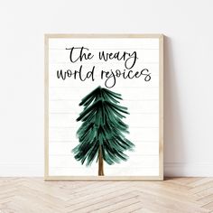 a wooden sign with the words, the weary world projects on it and a pine tree