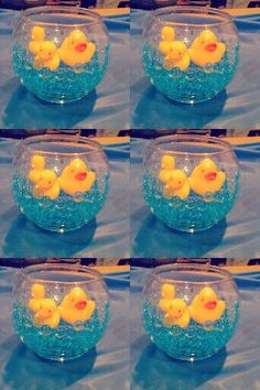 several images of yellow rubber ducks in a bowl with blue water and bubbles on the bottom