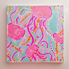 a square painting with pink and blue jellyfish on it's sides, against a white background