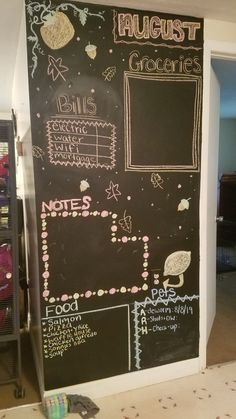 a chalk board with writing on it in a room