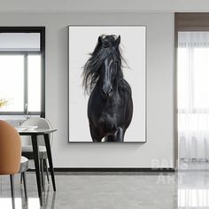 a black horse standing in the middle of a room next to a table and chairs