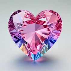 a pink heart shaped diamond on a white background