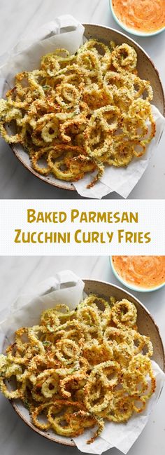 baked parmesan zucchini curly fries in a bowl with sauce on the side