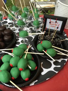 there are many desserts on the table ready to be eaten at this birthday party