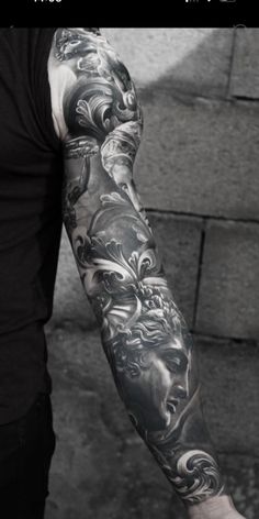 a man with a tattoo on his arm