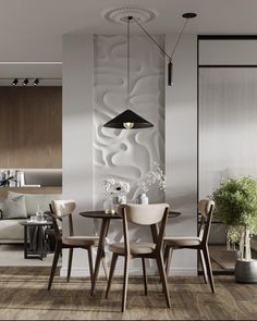 a dining room table and chairs in front of a white wall