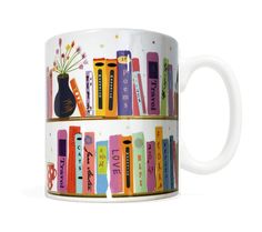 a coffee mug with colorful books on it