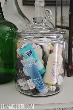 a jar filled with lots of different types of items