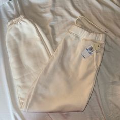 Off White/Cream, Size Medium, Women’s Joggers. Never Worn. Casual Cream Sweatpants For Spring, White Summer Sweatpants With Pockets, Cream Bottoms With Pockets For Loungewear, Cream Sweatpants With Pockets, Cream Sweatpants With Pockets For Loungewear, White Spring Joggers With Elastic Waistband, White Joggers With Elastic Waistband For Spring, White Sweatpants With Elastic Waistband For Spring, Sporty Cream Bottoms For Spring