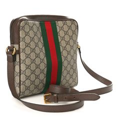 This is the authentic GUCCI GG Supreme Monogram Web Small Ophidia Messenger Bag in Brown. This camera-style crossbody bag is crafted of monogram coated canvas with brown leather trim. The bag features a brown leather adjustable shoulder strap, a front zipper pocket with the signature green and red web, and aged gold hardware. This opens to a natural fabric interior with a zipper pocket. Red Web, Natural Fabric, Green And Red, Natural Fabrics, Leather Trim, Leather Trims, Front Zipper, Gold Hardware, Zipper Pocket