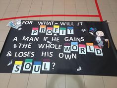 a banner with words written on it that say, for what will it proclaim if he gains the whole world and loses his own soul?