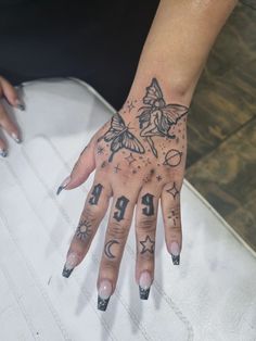 Butterfly Hand Tattoo With Sparkles, Spiritual Tattoos Hand, Fairy Hand Tattoo, Angel Number Hand Tattoo, Hand Tats For Women, Butterfly Hand Tattoos, Star Hand Tattoos, Hand Tattoo Women, Angel Hand Tattoo