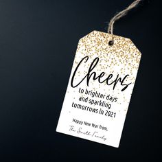 a tag with the words cheers to brighter days and sparkling tomorrow in 2021 on it