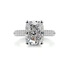 a cushion cut diamond ring with pave set shoulders