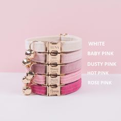 the pink, white and gold bracelets are stacked on top of each other in different colors