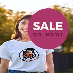 a woman wearing a t - shirt with the words sale on now in front of her