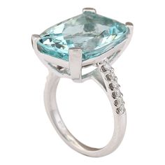 Stamped: 14K White Gold Total Ring Weight: 9.8 Grams Ring Length: N/ARing Width: N/A Gemstone Weight: Total Natural Aquamarine Weight is 14.03 Carat (Measures: 18.35x14.10 mm) Color: Blue Diamond Weight: Total Natural Diamond Weight is 0.30 Carat Quantity: 12 Color: F-G, Clarity: VS2-SI1 Face Measures: 18.35x14.10 mm Sku: [703560W] Luxury White Gold Ring With Aquamarine, Luxury Aquamarine Diamond Ring With Prong Setting, Luxury White Gold Aquamarine Ring, Luxury Aquamarine Rings With Prong Setting, Formal Aquamarine Ring With Diamond Accents, White Gold Brilliant Cut Aquamarine Rings, White Gold Aquamarine Rings With Brilliant Cut, Luxury Aquamarine Promise Ring, White Gold Blue Topaz Cushion Cut Ring