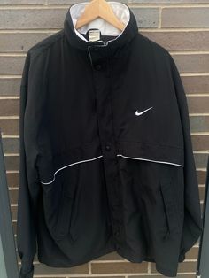 Vintage 1990s Nike Embroidered Swoosh Windbreaker Track Jacket - Size XL (Length 32", Chest 26") - Great vintage condition (no holes/no stains) - On the very rare 90s Made in USA Nike tag!! - Message for more information Please take note of the measurements listed as these are vintage clothes and may fit different than the tag size. Follow our page for more vintage clothing drops! Connect with us on Instagram: @recurarchives Nike 90s Vintage Women, Jacket Nike Vintage, Nike 90s Vintage Hoodie, Sporty Windbreaker For College Sports Season, Sporty Crew Neck Track Jacket For Streetwear, Black Sportswear Track Jacket For College, Sporty Crew Neck Outerwear For Sports, Sporty Black Windbreaker For College, Sporty Black Windbreaker For Sports Season