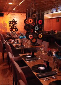 a long table is set with place settings for two people to sit down and eat