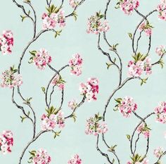 a blue background with pink and white flowers on it's branches in the middle