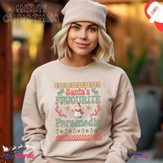 Embrace the festive spirit with our Santa's Favourite Paramedic Ugly Christmas Sweatshirt! This cozy garment, featuring a unique and humorous design, is the ideal choice for medics and first responders during the holiday season. Crafted from a comfortable, midweight cotton-blend material, this sweatshirt is perfect for staying warm while celebrating Christmas. Whether you're on duty or off, showcase your paramedic pride with style. Celebrate the season with a touch of medical humor. This sweatshirt makes for a thoughtful and festive gift for the dedicated paramedic in your life. Spread joy and laughter this Christmas with a sweatshirt that combines comfort and holiday cheer. Ideal for any situation, a unisex heavy blend crewneck sweatshirt is pure comfort. These garments are made from poly Hoodies Vintage, Jolly Af, Winter Hoodie, Holiday Sweatshirt, Tree Shirt, Sweatshirt Christmas, Equal Rights, Look Plus, Christmas Sweatshirts