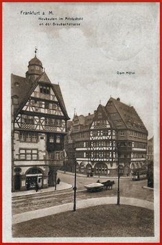 an old black and white photo of buildings in the middle of town with a red border around it