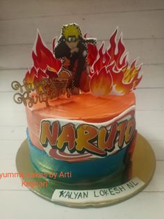 a birthday cake with the name naruta on it and flames in the background