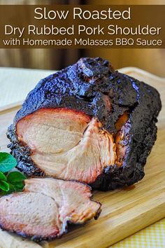 slow roasted pork shoulder with homemade molasses bbq sauce on a cutting board