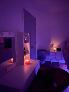 a bedroom with purple lighting and a bed