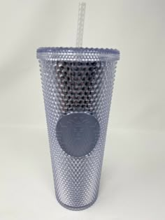 a plastic cup with a straw in it