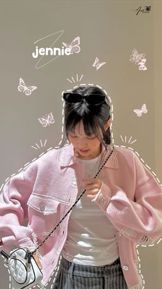 a young woman wearing a pink jacket and holding a white purse with butterflies on the wall behind her