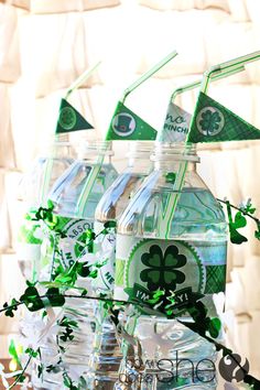 st patrick's day water bottles with shamrocks on them and green paper flags