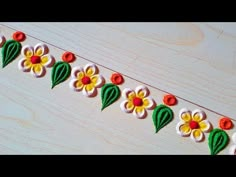 a close up of a string with flowers on it