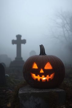 a carved pumpkin sitting on top of a grave