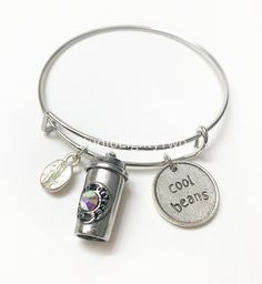 Bracelet features a Starbucks inspired coffee cup charm A silver coffee bean Silver round charm that says cool beans Trendy Silver Charm Bracelet For Everyday, Trendy Silver Round Charm Bracelet, Casual Silver Charm Bracelet As Gift, Casual Silver Hypoallergenic Bracelets, Casual Hypoallergenic Silver Bracelets, Nickel-free Stainless Steel Casual Jewelry, Casual Stainless Steel Nickel-free Jewelry, Personalized Silver Casual Jewelry, Casual Nickel-free Stainless Steel Jewelry