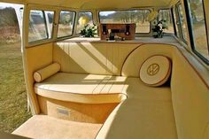 the interior of an old car with sunroofs and flowers on the seats